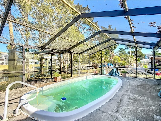 view of swimming pool with a lanai