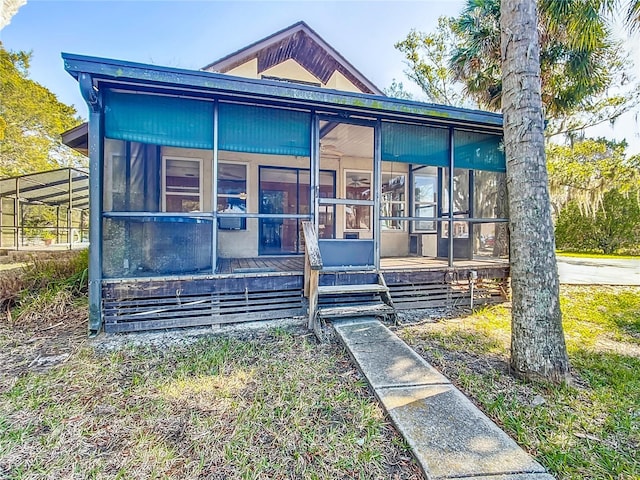 view of front facade featuring a sunroom