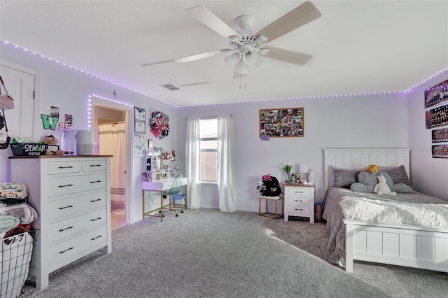 carpeted bedroom featuring ceiling fan and ensuite bath