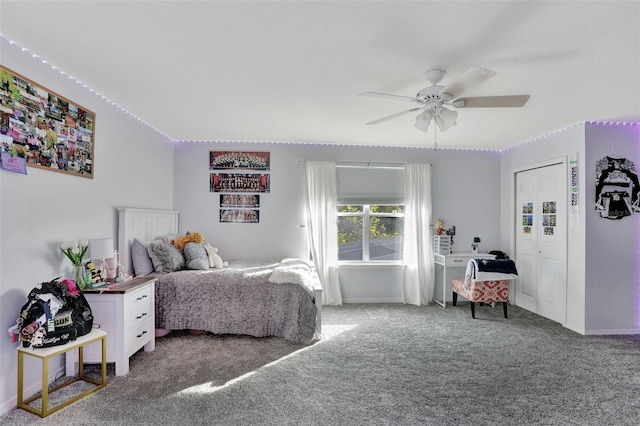 carpeted bedroom with ceiling fan and a closet