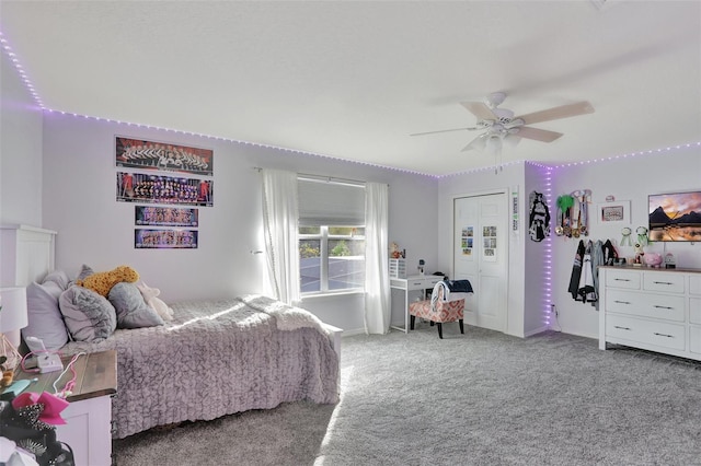 bedroom featuring ceiling fan, a closet, and carpet floors