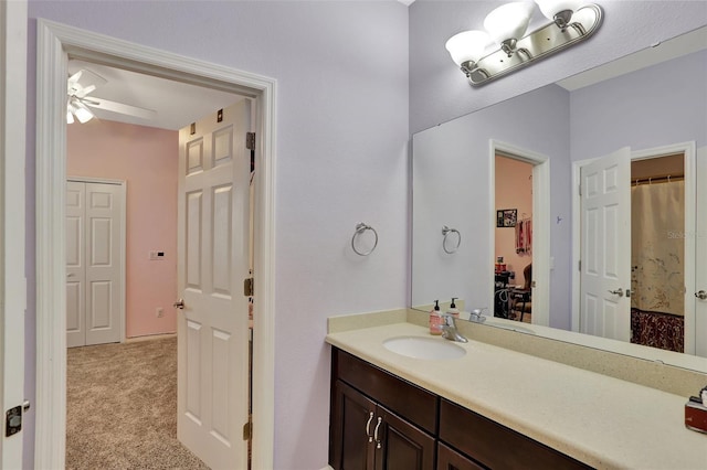 bathroom with ceiling fan and vanity