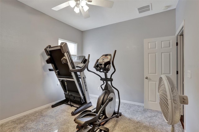 workout room featuring ceiling fan and light colored carpet