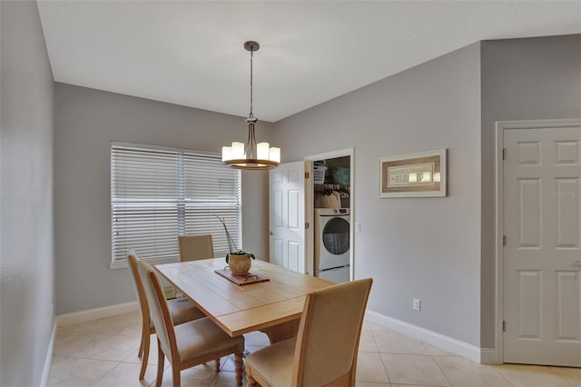 tiled dining area with washer / dryer