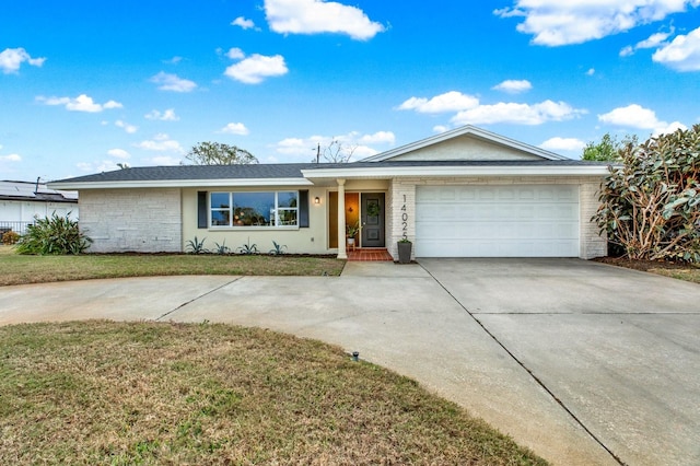 single story home with a front yard and a garage