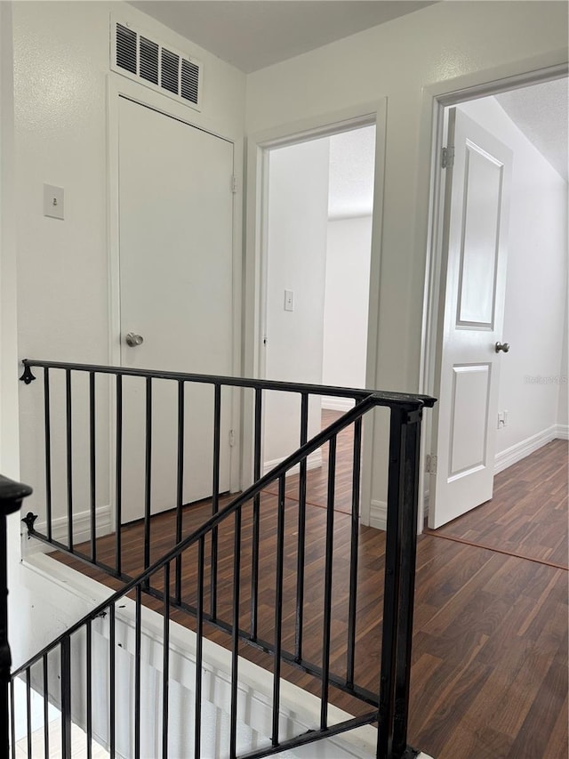 hall with dark hardwood / wood-style floors