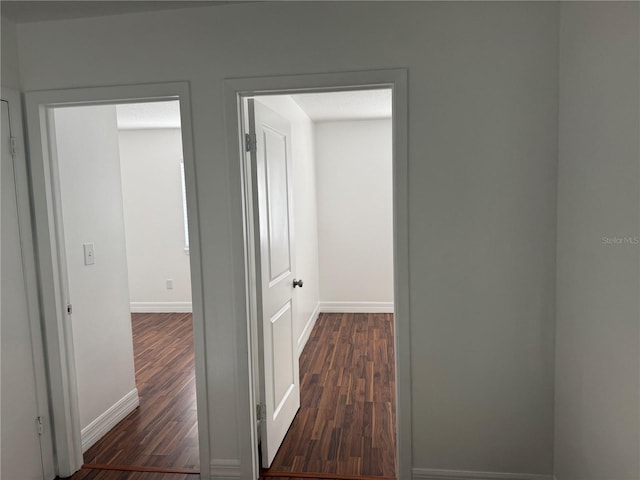 hall with dark hardwood / wood-style floors