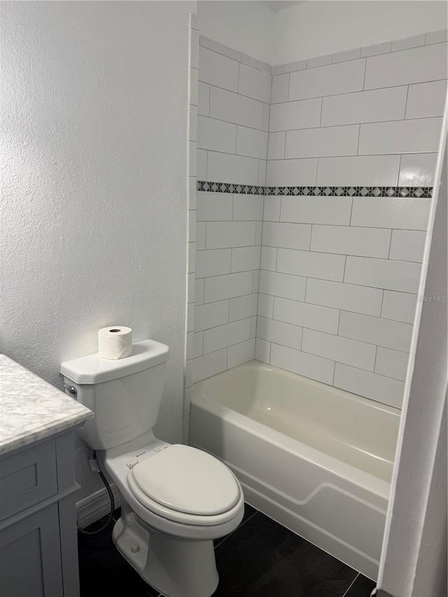 full bathroom featuring vanity, tile patterned flooring, shower / tub combination, and toilet