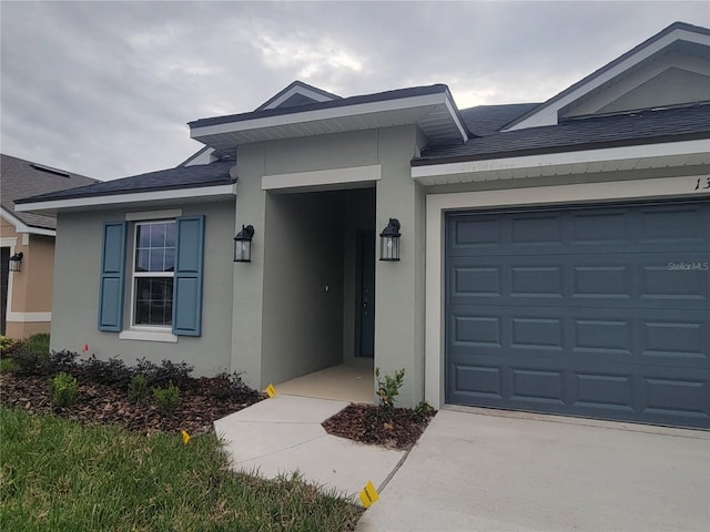 view of front of property featuring a garage