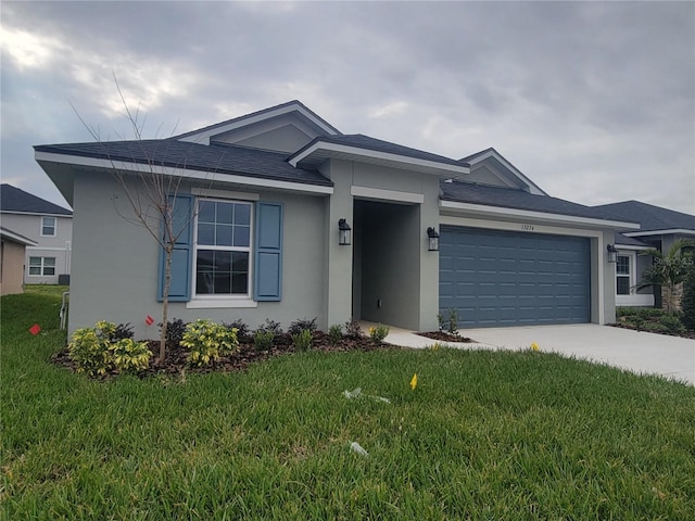 view of front of house featuring a garage and a front yard