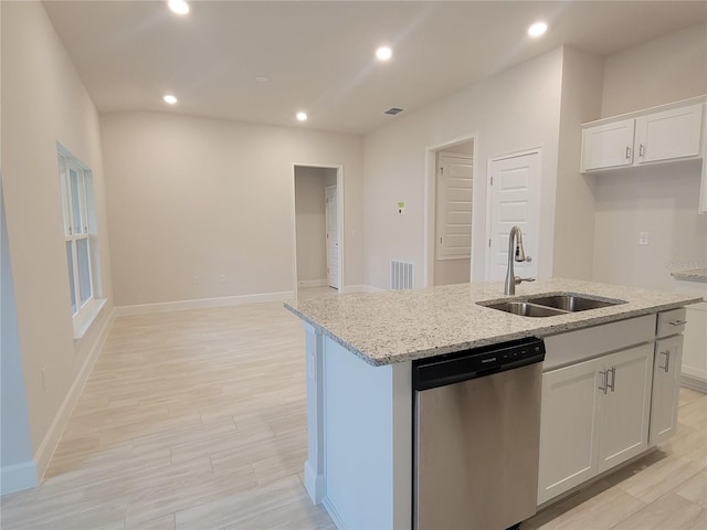 kitchen with sink, white cabinetry, a kitchen island with sink, light stone counters, and stainless steel dishwasher