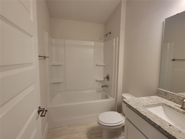 full bathroom featuring shower / washtub combination, vanity, and toilet