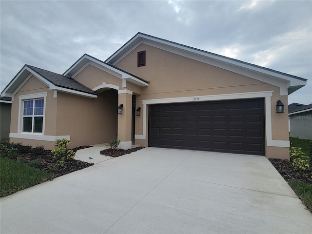 view of front of property with a garage