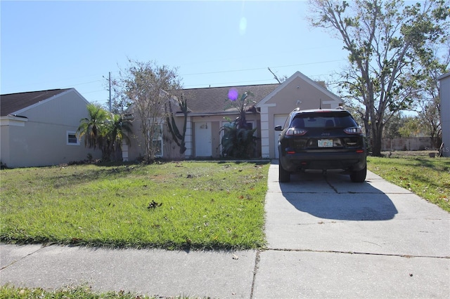 single story home with a front lawn and a garage