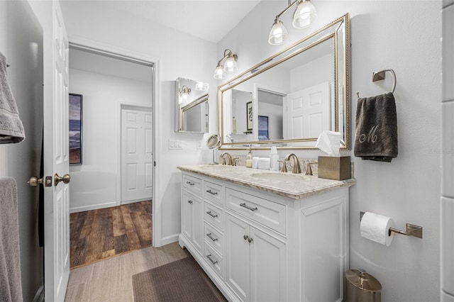 bathroom featuring vanity and wood-type flooring