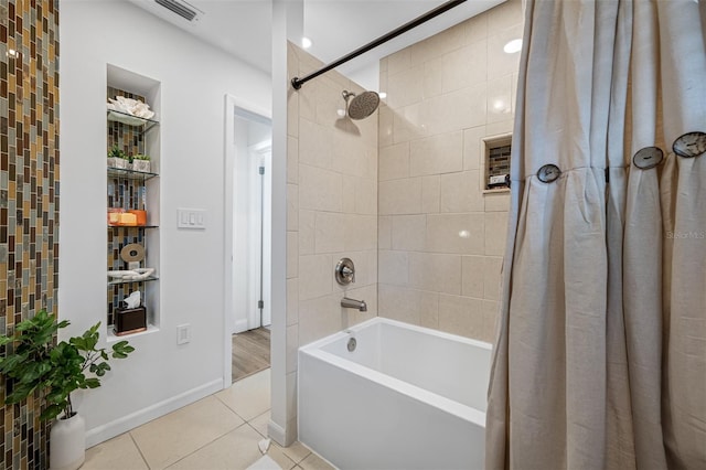 bathroom featuring tile patterned floors and shower / tub combo with curtain