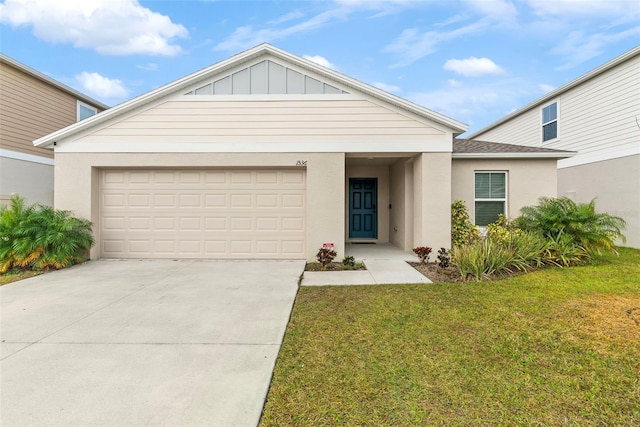 view of front of house featuring a front lawn and a garage