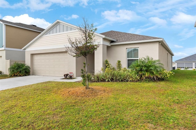 view of front of property with a garage and a front yard