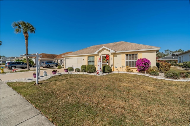 ranch-style house featuring a garage, stucco siding, concrete driveway, and a front yard