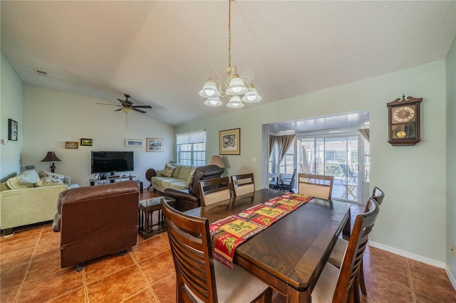 dining space featuring vaulted ceiling, a textured ceiling, a wealth of natural light, and tile patterned floors