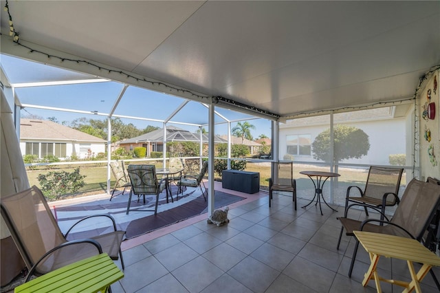 sunroom featuring a residential view