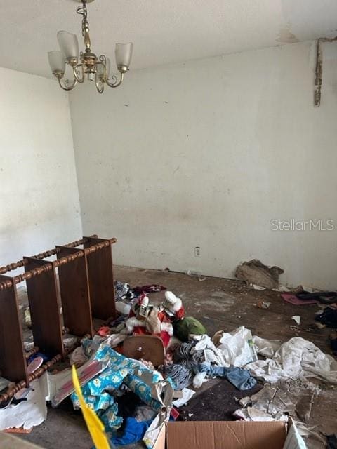 miscellaneous room featuring a chandelier