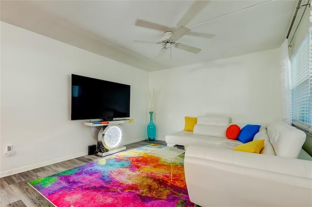 living room featuring hardwood / wood-style flooring and ceiling fan