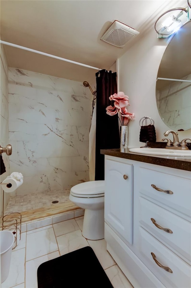 bathroom with toilet, vanity, and a shower with shower curtain