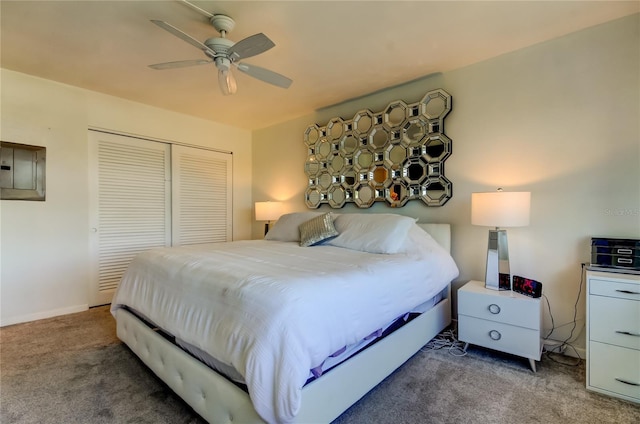 carpeted bedroom with ceiling fan, electric panel, and a closet