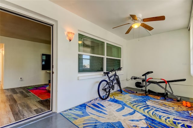 workout area featuring ceiling fan