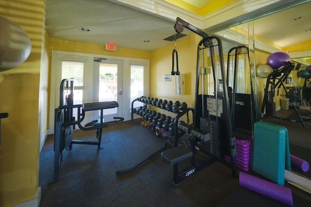 workout area with a textured ceiling