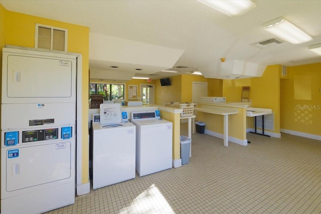 washroom with stacked washer / drying machine