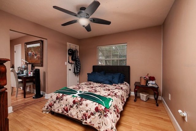 bedroom featuring ceiling fan and light hardwood / wood-style floors