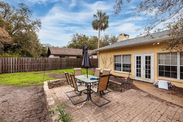 view of patio featuring french doors