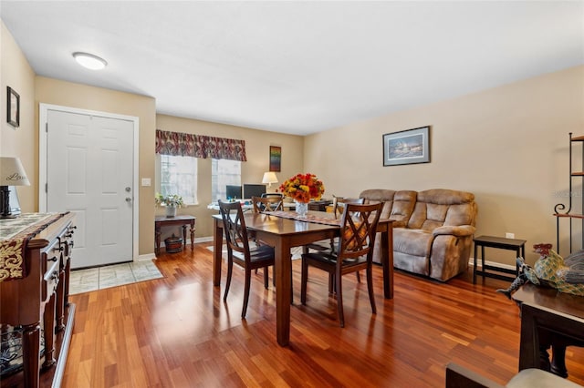 dining area with hardwood / wood-style flooring