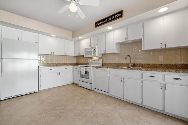 kitchen with white cabinets, white appliances, backsplash, and sink