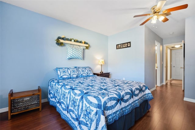 bedroom with ceiling fan and dark wood-type flooring