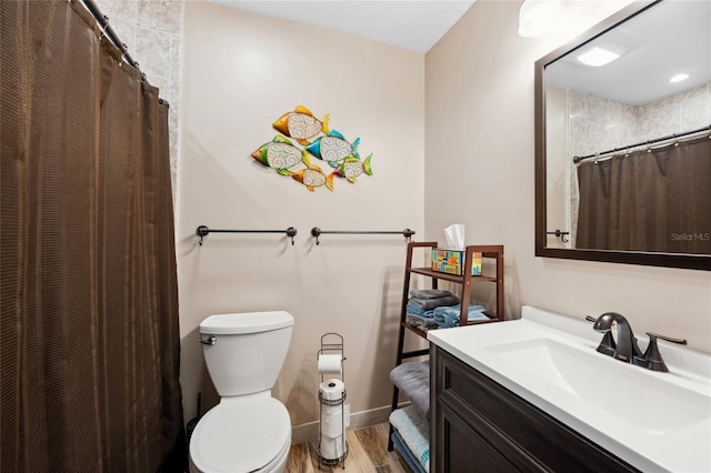 bathroom featuring vanity, curtained shower, toilet, and wood-type flooring