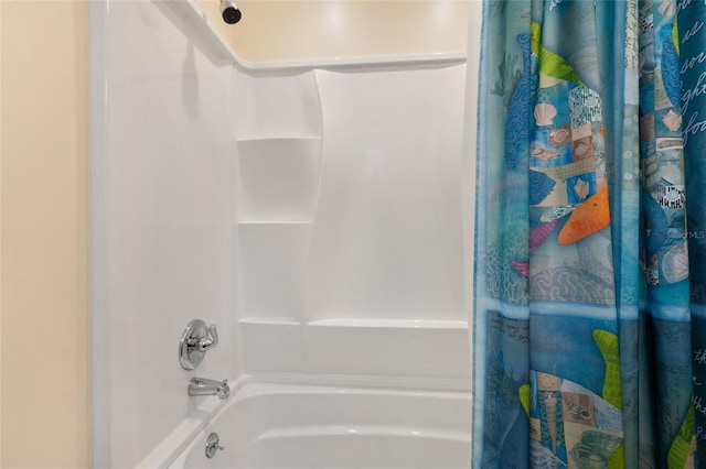 bathroom with shower / tub combo with curtain