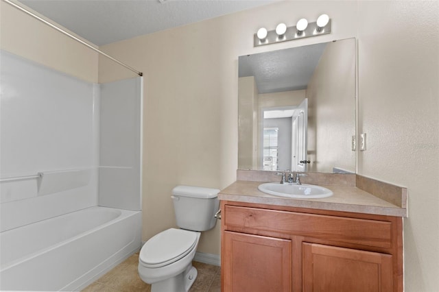 full bathroom featuring washtub / shower combination, tile patterned flooring, vanity, a textured ceiling, and toilet