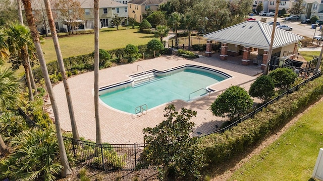 view of swimming pool with a lawn and a patio area