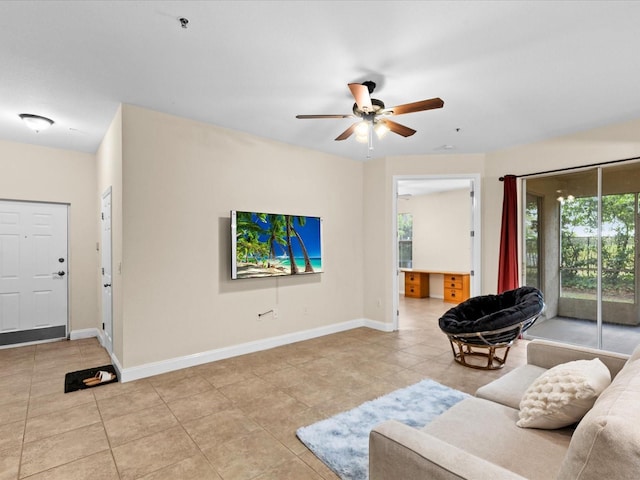 tiled living room featuring ceiling fan