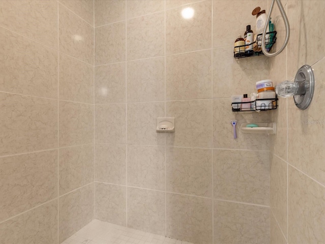 bathroom with tiled shower