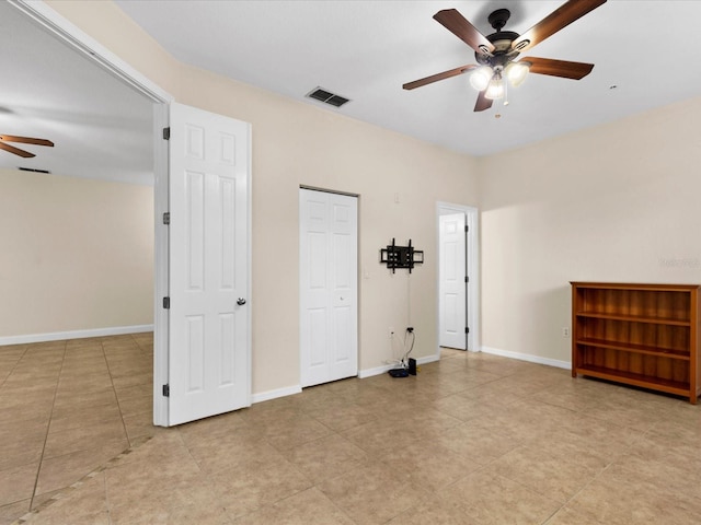 unfurnished bedroom featuring ceiling fan