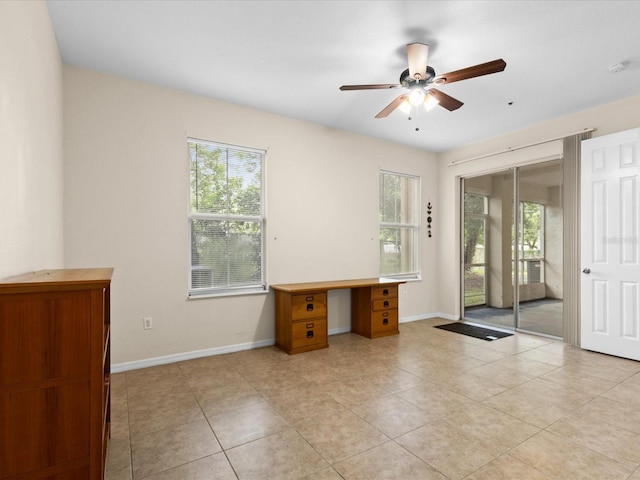 unfurnished office featuring ceiling fan and light tile patterned floors