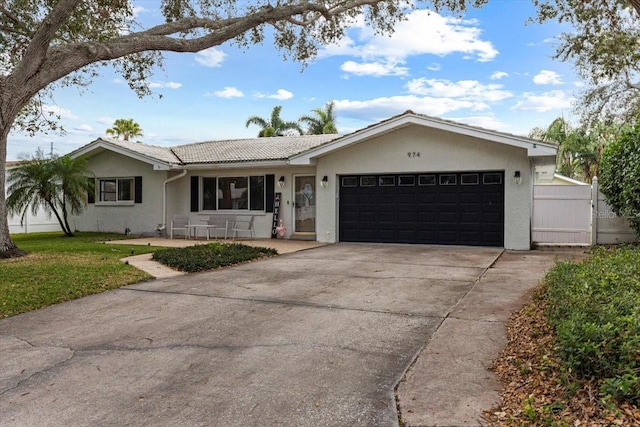 ranch-style house featuring a garage