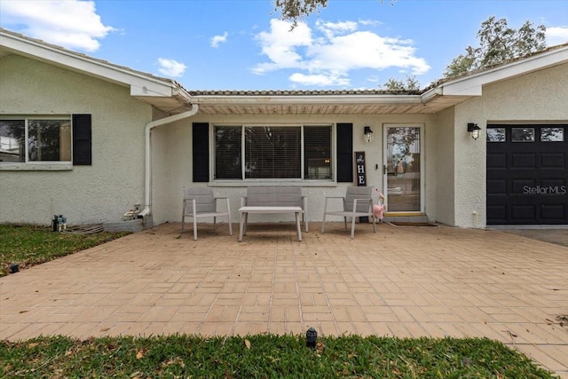 view of patio featuring a garage