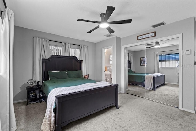 bedroom featuring ceiling fan, a closet, and carpet flooring