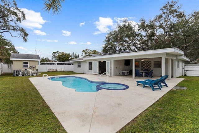 view of pool with ceiling fan, an in ground hot tub, a lawn, central AC unit, and a patio