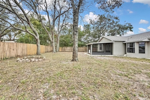 view of yard featuring a sunroom